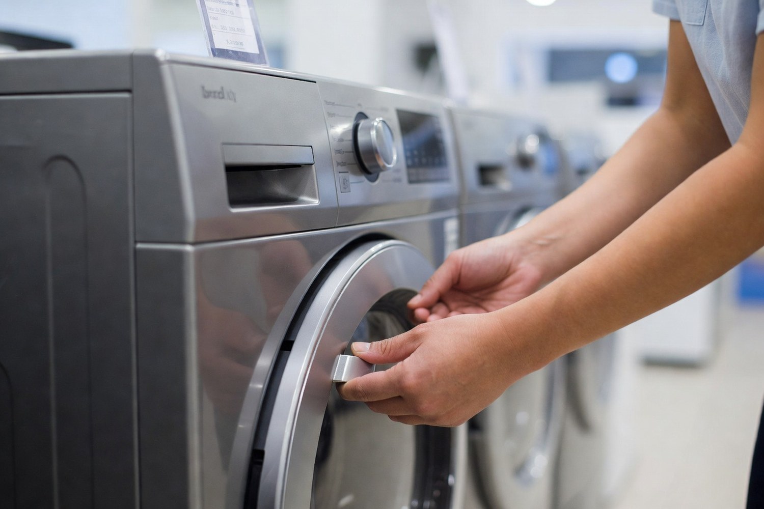 Person shopping for a washing machine representing appliance financing costs and options