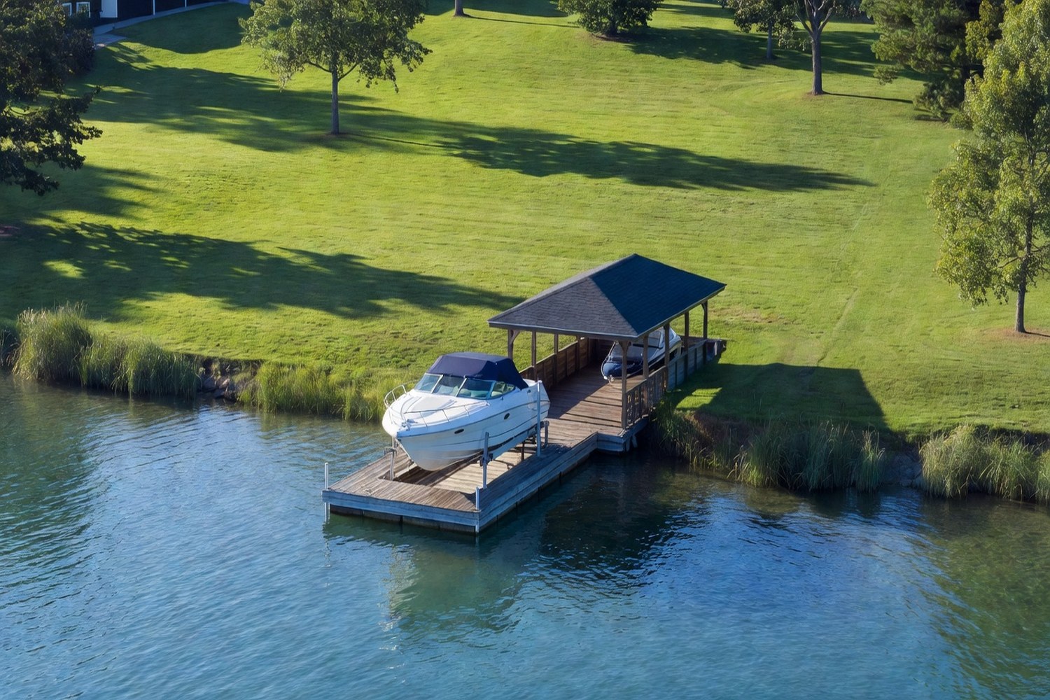 Lakefront property with private dock and boat lift representing dock financing investment