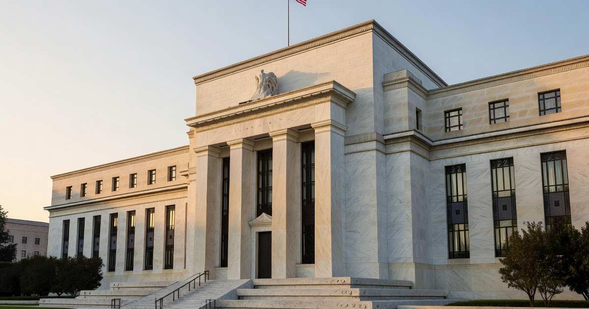 The marble neoclassical facade of the Federal Reserve headquarters in Washington beneath an American flag at dawn