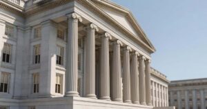 The United States Treasury Department neoclassical stone building with tall columns under a clear sky, representing federal government borrowing
